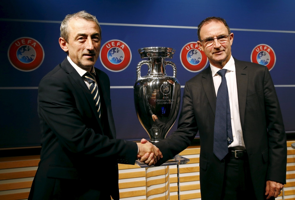 Ireland's coach Martin O'Neill shakes hand with Bosnia and Herzegovina's coach Mehmed Bazdarevic after the draw for the play-off matches for UEFA Euro 2016 at the UEFA headquarters in Nyon Switzerland