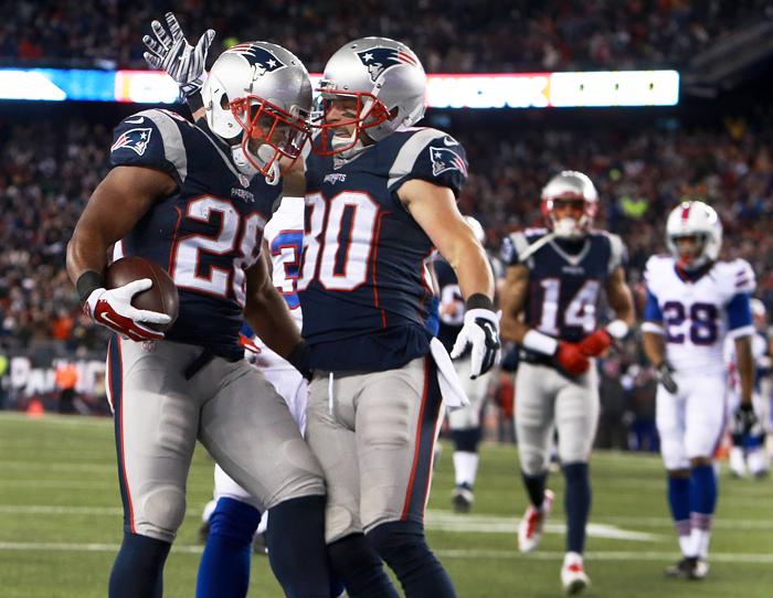 11/23/15 Foxborough MA After Patriots RB James White glidedinto the end zone with a 20 yard touchdown play at the end of the first half he celebrates with teammate Danny Amendola at right. Amendola would be injured later in the game. The New