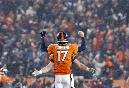 Denver Broncos quarterback Brock Osweiler celebrates the game winning touchdown during overtime of an NFL football game against the New England Patriots Sunday in Denver