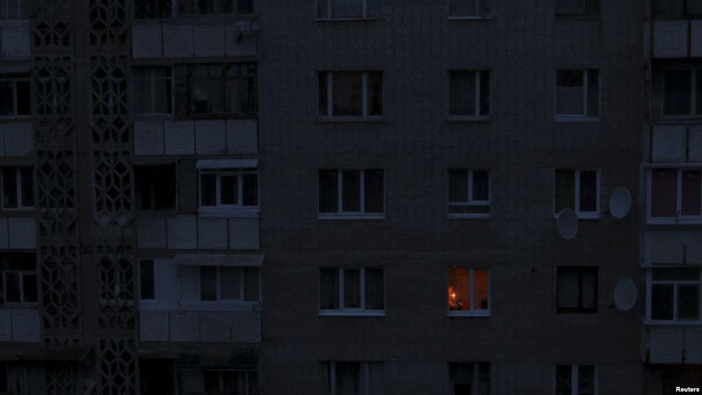 A single light illuminates a room Nov. 24 2015 during a blackout at a residential building in Simferopol Crimea. Crimea continued to rely on emergency generators to meet its basic power needs