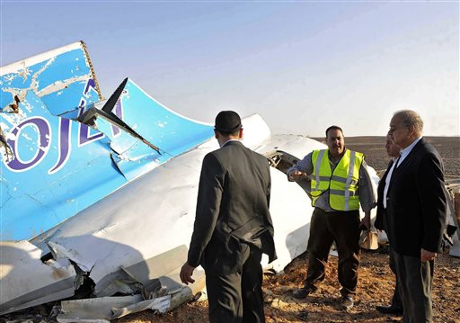 Prime Minister's office Egyptian Prime Minister Sherif Ismail right looks at the remains of a crashed Russian passenger jet in Hassana Egypt. Egyptian media have reacted with fury