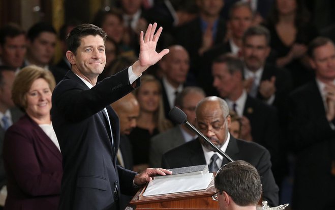 Newly sworn-in Speaker of the House Paul Ryan waves to colleagues on Thursday in Washington D.C