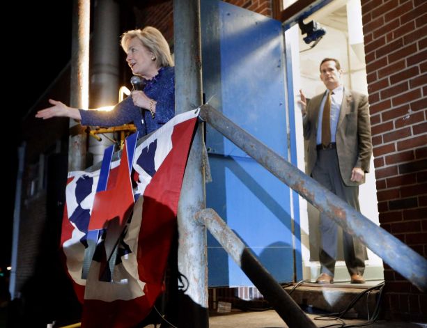 Democratic presidential candidate Hillary Rodham Clinton speaks from a gymnasium side porch to people who weren't able to fit in to hear her speech at Fisk University Friday Nov. 20 2015 in Nashville Tenn