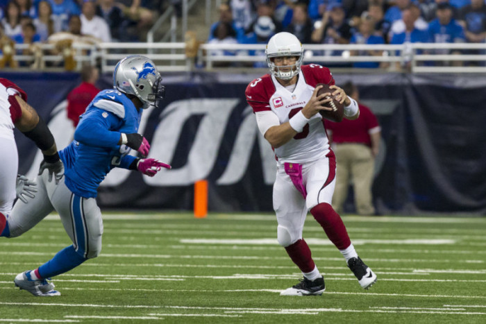 11 OCTOBER 2015 Arizona Cardinals quarterback Carson Palmer runs with the ball during game action between the Arizona Cardinals and the Detroit Lions during a regular season game played at Ford Field in Detroit Michigan