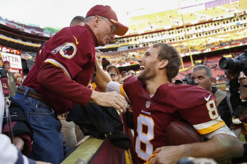 Washington Redskins quarterback Kirk Cousins is greeted by his dad Don Cousins after an NFL football game against the New Orleans Saints in Landover Md. Sunday Nov. 15 2015. The Redskins defeated the New Orleans Saints 47-14. (AP