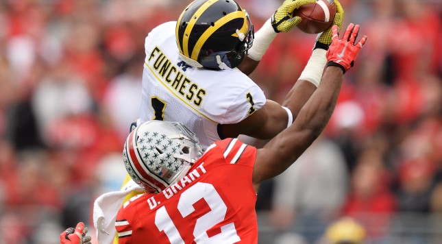 COLUMBUS OH- NOVEMBER 29 Devin Funchess #1 of the Michigan Wolverines catches a 45-yard pass in front of Doran Grant #12 of the Ohio State Buckeyes in the first quarter at Ohio Stadium