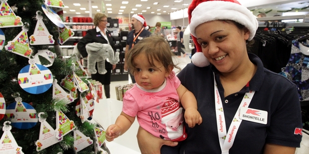Shontelle Bennett and her 11-month old daughter Jakayda Anderson visit the Kmart Wishing Tree
