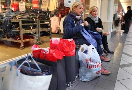 Constanze Nied and her friend Kirsten Friese both from Germany took a rest during Black Friday shopping at the Cambridgeside Galleria in 2014