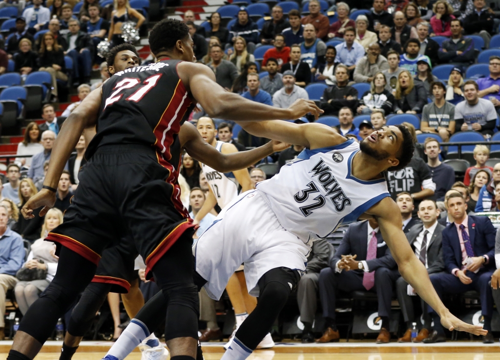 Minnesota Timberwolves’ Karl Anthony Towns right is fouled by Miami Heat’s Hassan Whiteside after a shot-attempt in the first quarter of an NBA basketball game Thursday Nov. 5 2015 in Minneapolis. AP