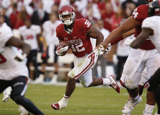 Oklahoma running back Samaje Perine carries during an NCAA college football game against Texas Tech in Norman Oklahoma