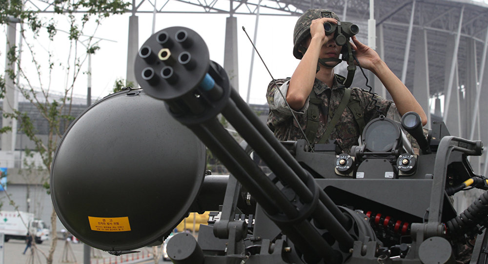 A South Korean army soldier uses a pair of binoculars during an anti-terror drill ahead of the 2014 Incheon Asian Games outside of Incheon Asiad Main Stadium in Incheon South Korea Wednesday Aug. 6 2014