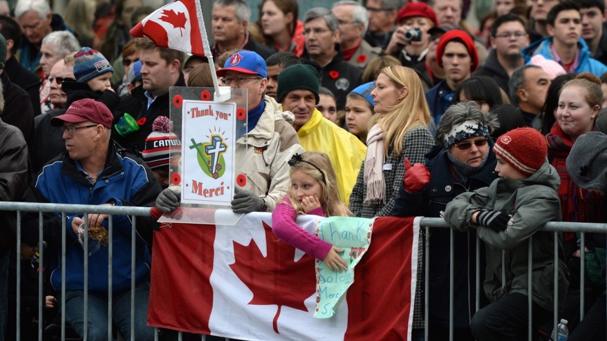 Spectators wait for the Remembrance Day ceremony to start in Ottawa on Wednesday Nov. 11 2015. THE CANADIAN PRESS  Sean Kilpatrick