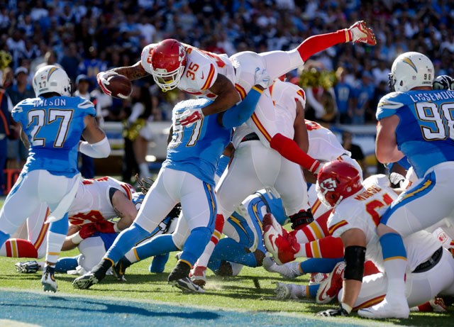 Kansas City Chiefs running back Charcandrick West top is kept out of the end zone by San Diego Chargers linebacker Joe Mays during the first half of an NFL football game Sunday Nov. 22 2015 in San Diego