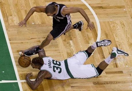 Marcus Smart of the Celtics steals the ball from San Antonio's Tony Parker and then passes to a cutting teammate for a bucket at the TD Garden