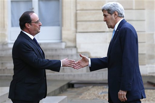 French President Francois Hollande left welcomes US Secretary of State John Kerry upon arrival at the Elysee Palace in Paris France Tuesday Nov. 17 2015