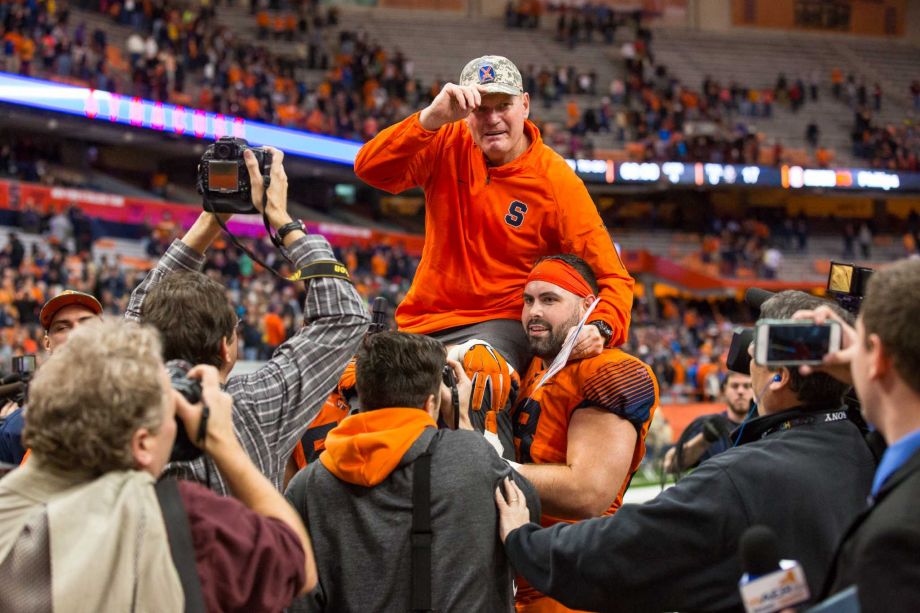 SYRACUSE NY- NOVEMBER 28 Head coach Scott Shafer of the Syracuse Orange is carried off the field by his players after the game against the Boston College Eagles