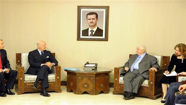 Syria's Foreign Minister Walid al Mualem is seen during a meeting with the UN special envoy to Syria Staffan de Mistura in the capital Damascus