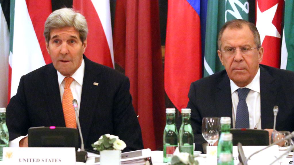 U.S. Secretary of State John Kerry left and Russian Foreign Minister Sergei Lavrov confer in Vienna Austria Nov. 14 2015. Foreign ministers from more than a dozen nations are meeting in Vienna seeking to find a way to resolve the conflict in Syria