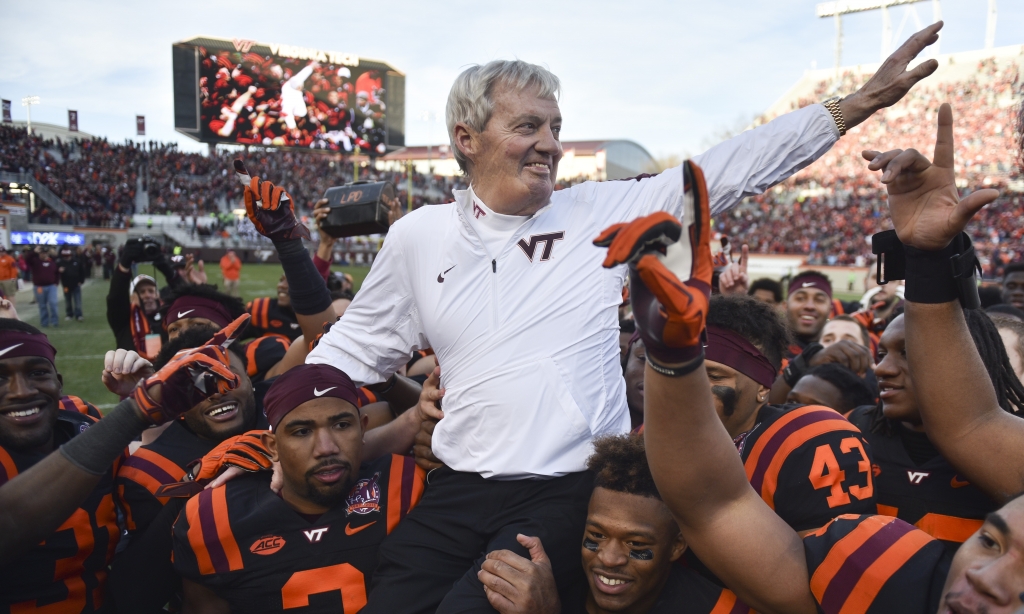 Head coach of the Virginia Tech Hokies Frank Beamer is carried off the field following the game against the North Carolina Tar Heels