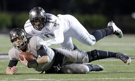 Shurmur is brought down by Texas A&M defensive lineman Daeshon Hall in the first half of an NCAA college football game Saturday Nov. 21 2015 in Nashville Tenn