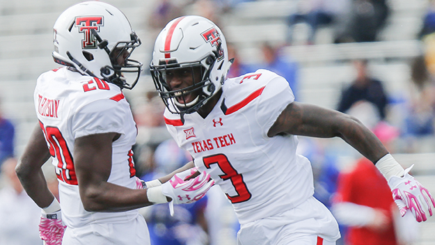 LAWRENCE KS- OCTOBER 17 J.J. Gaines #3 celebrates with Tevin Madison #20 of the Texas Tech Red Raiders after Gaines recovered a Kansas Jayhawks fumble during the game