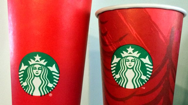 The 2015 and 2014 Starbucks festive cups the 2015 cup has made Mr Trump see red