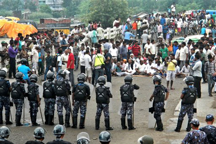 The police also allegedly used batons on protesters blocking crucial bridge at Indo Nepal border