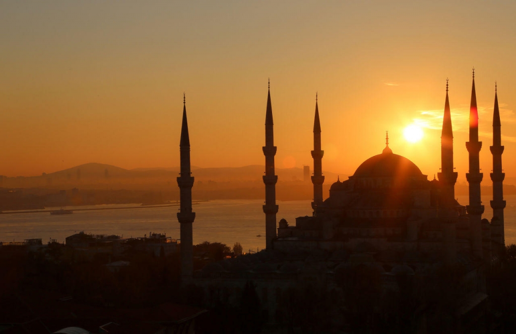 The sun rises over the Sultan Ahmed Mosque known popularly as the Blue Mosque in Istanbul