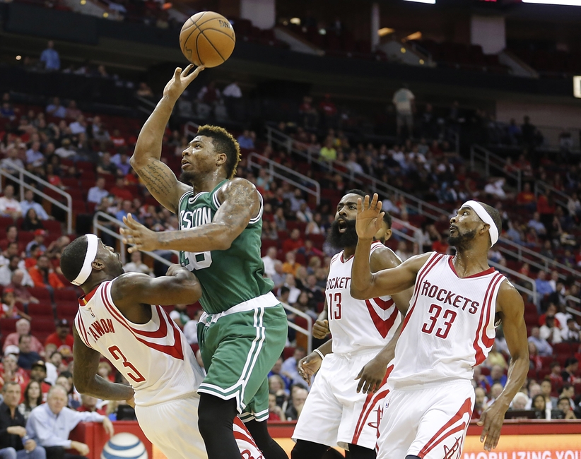 Nov 16 2015 Houston TX USA Boston Celtics guard Marcus Smart shoots against Houston Rockets guard Ty Lawson while guard James Harden and guard Corey Brewer follow in the second quarter at Toyota Center. Mandatory Credit Thomas B