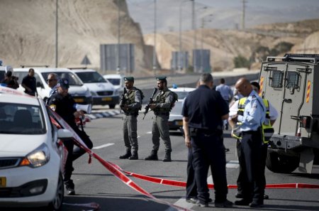 Israeli paramilitary police officers stand guard at the scene of what police said was an attempted ramming attack near the West Bank Jewish settlement of Kfar Adumim