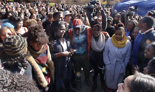 Supporters gather after the announcement that University of Missouri System President Tim Wolfe would resign Monday Nov. 9 2015 in Columbia Mo. Wolfe resigned Monday with the football team and others on campus in open revolt over his handling of racia