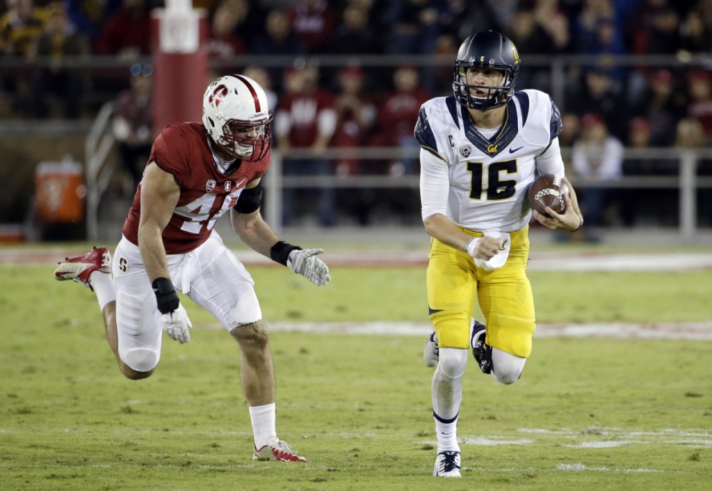 California quarterback Jared Goff runs past Stanford linebacker Kevin Anderson during the first half of an NCAA college football game Saturday Nov. 21 2015 in Stanford Calif