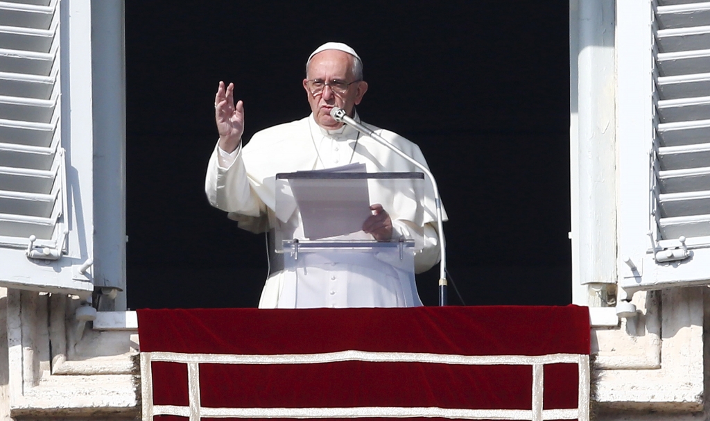 Pope Francis gestures during his Sunday Angelus prayer in Saint Peter's square at the Vatican