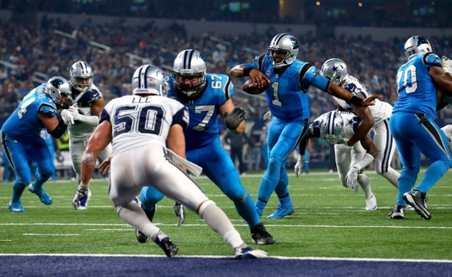 Cam Newton of the Carolina Panthers runs for a touchdown against the Dallas Cowboys in the second half at AT&T Stadium