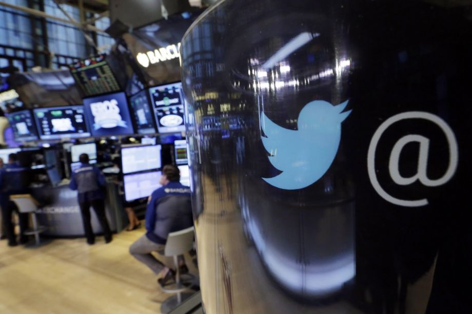 The Twitter logo appears on a phone post on the floor of the New York Stock Exchange Tuesday Oct. 13 2015. Twitter on Tuesday announced that it's replacing its star-shaped'favorite button with a heart-shaped'like button. Pho