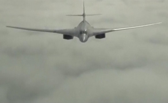 A Russian Tupolev Tu-160 long-range bomber flying over an unknown location in Syria