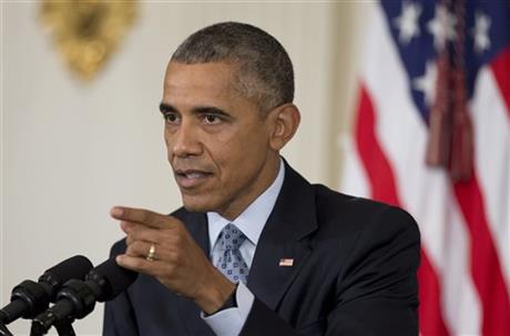 US President Barack Obama speaks to reporters in the State Dining Room of the White House in Washington