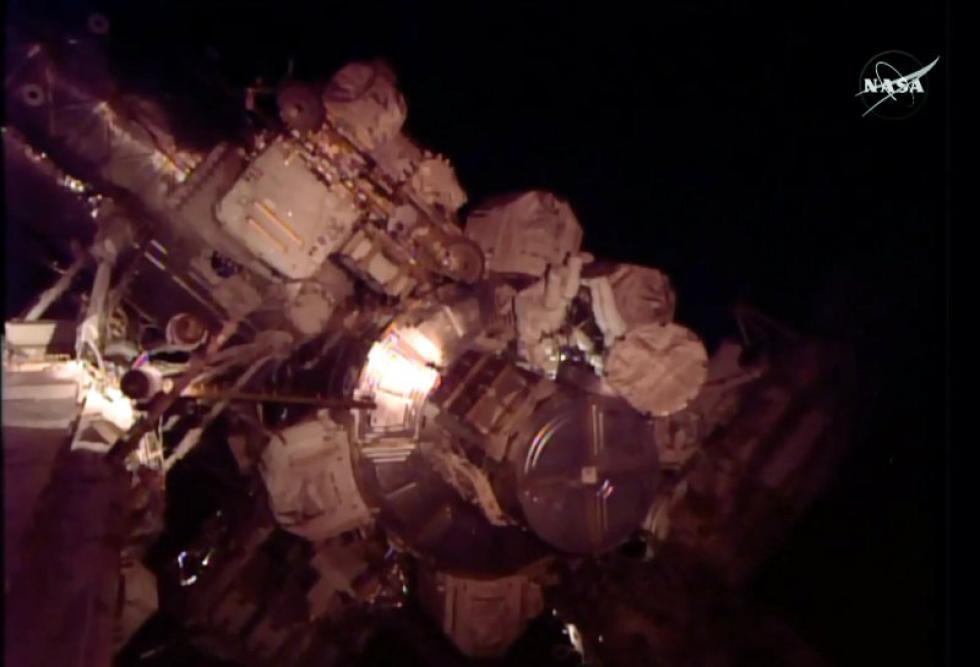 Associated Press
In this frame grab from NASA Television on Friday astronauts Scott Kelly and Kjell Lindgren perform maintenance outside the International Space Station. This excursion involves work on the space station's cooling system. Kelly has