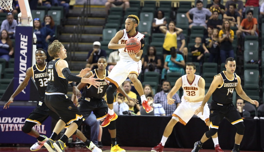 USC guard Jordan Mc Laughlin sets up for a jump-pass while guarded by Wichita State forward Markis Mc Duffie, guard Ron Baker, forward Anton Grady and guard John Robert Simon during the second half of an NCAA college basketball game