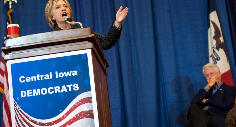 Democratic U.S. presidential candidate Hillary Clinton speaks as Former U.S. president Bill Clinton listens at the Central Iowa Democrats Fall Barbecue in Ames Iowa