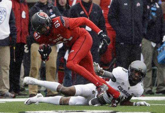 Ahkello Witherspoon reaches for Utah wide receiver Tyrone Smith in the first half during an NCAA college football game Saturday Nov. 28 2015 in Salt Lake City