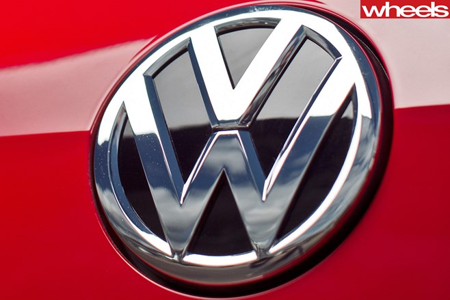 Volkswagen badge on Red Golf TDI