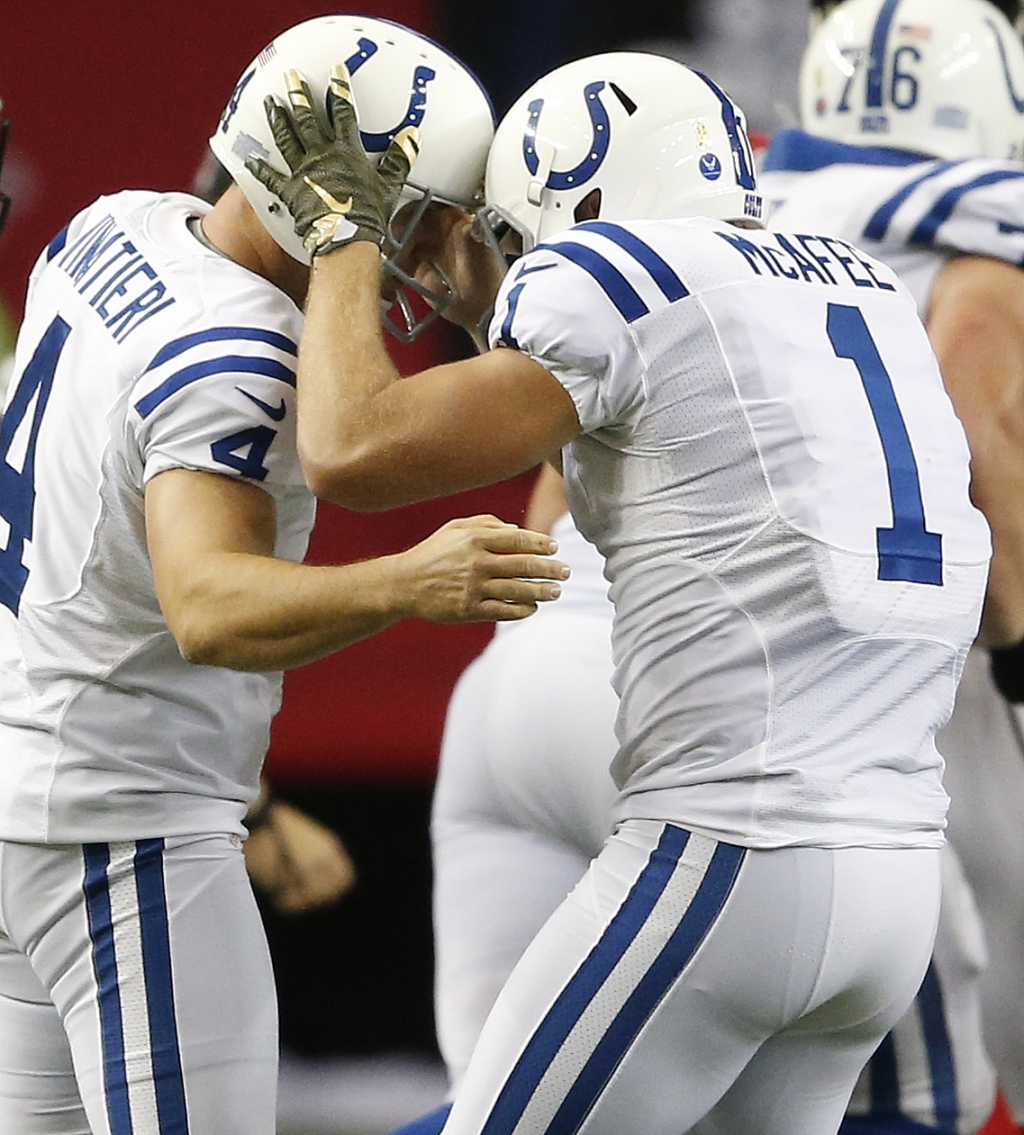 Indianapolis Colts punter Pat Mc Afee celebrates the field goal of Indianapolis Colts kicker Adam Vinatieri during the second half of an NFL football game against the Atlanta Falcons Sunday Nov. 22 2015 in Atlanta. Indianapolis Colts won 24-21