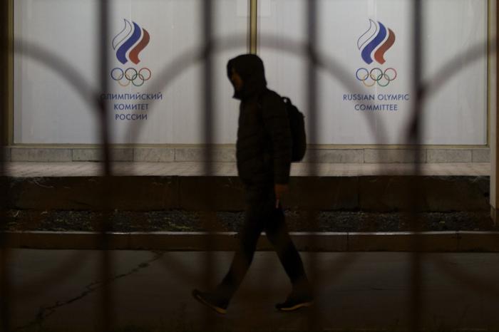 A man walks by the Russian Olympic committee building in Moscow Russia Monday Nov. 9 2015. Russian track and field athletes could be banned from next year's Olympics in Rio de Janeiro after a devastatingly critical report accused the country&apos