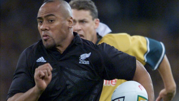 Jonah Lomu of the All Blacks evades Jason Little of Australia during a Tri Nations clash in Sydney