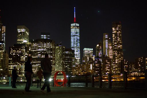 The One World Trade Center spire is lit blue white and red after New York Gov. Andrew Cuomo announced the lighting in honor of dozens killed in the Paris attacks Friday Nov. 13 2015 in New York. French officials say several dozen people have been kill