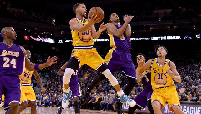 Stephen Curry over Jordan Clarkson during Warriors game against Lakers