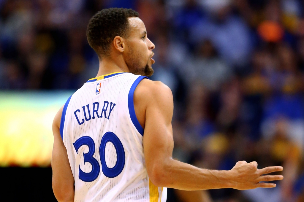 Nov 27 2015 Phoenix AZ USA Golden State Warriors guard Stephen Curry celebrates a three point shot in the first quarter against the Phoenix Suns at Talking Stick Resort Arena. Mandatory Credit Mark J. Rebilas-USA TODAY Sports