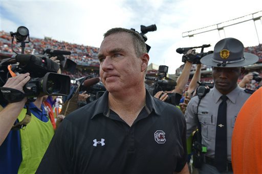 South Carolina interim head coach Shawn Elliott leaves the field after an NCAA college football game against Clemson Saturday Nov. 28 2015 in Columbia S.C. Clemson won 37-32