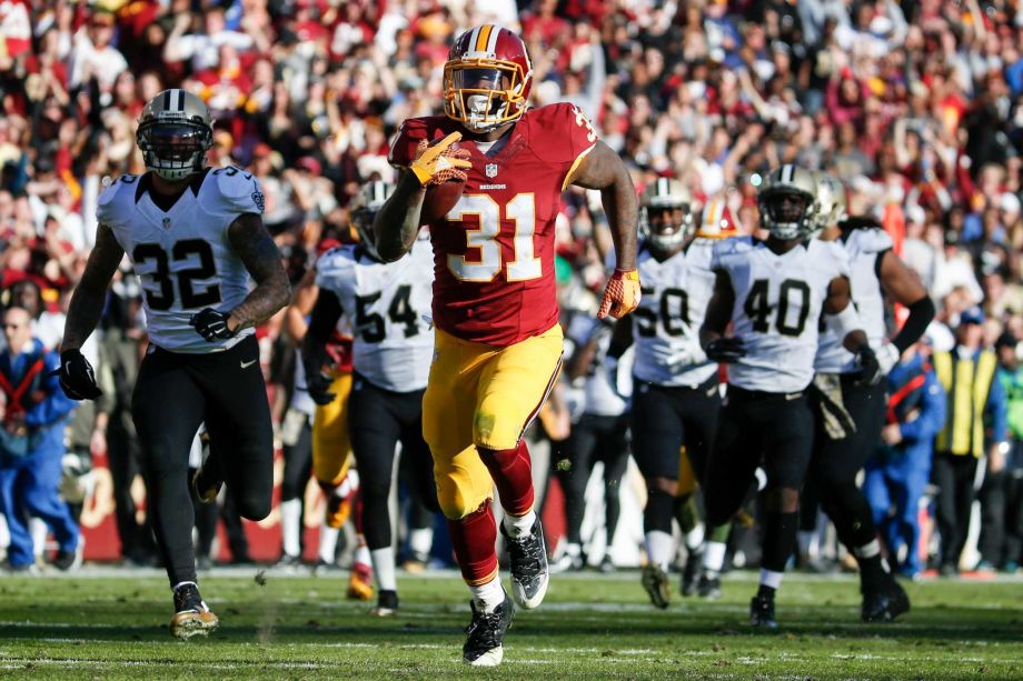 Washington Redskins running back Matt Jones outpaces the New Orleans Saints defense to score a 78 yard touchdown during the first half of an NFL football game in Landover Md. Sunday Nov. 15 2015